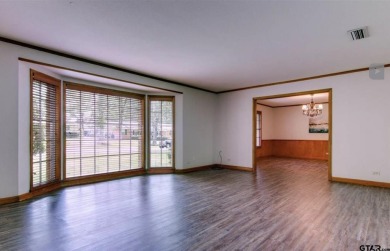 Welcome to this beautifully crafted ranch-style residence that on Mount Pleasant Country Club in Texas - for sale on GolfHomes.com, golf home, golf lot