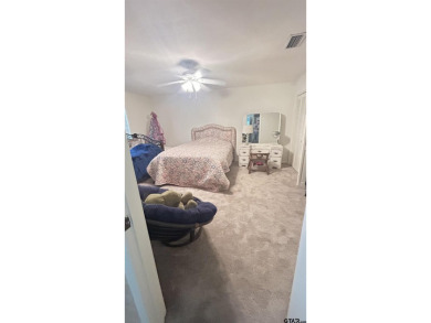 Welcome to this beautifully crafted ranch-style residence that on Mount Pleasant Country Club in Texas - for sale on GolfHomes.com, golf home, golf lot
