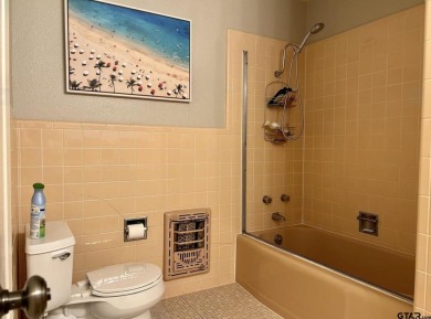 Welcome to this beautifully crafted ranch-style residence that on Mount Pleasant Country Club in Texas - for sale on GolfHomes.com, golf home, golf lot