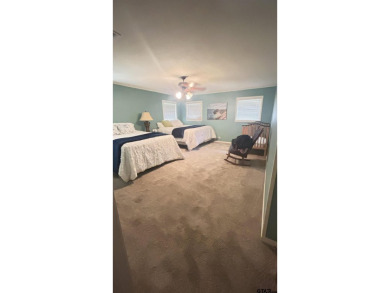 Welcome to this beautifully crafted ranch-style residence that on Mount Pleasant Country Club in Texas - for sale on GolfHomes.com, golf home, golf lot