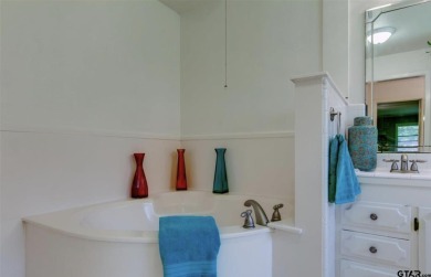 Welcome to this beautifully crafted ranch-style residence that on Mount Pleasant Country Club in Texas - for sale on GolfHomes.com, golf home, golf lot