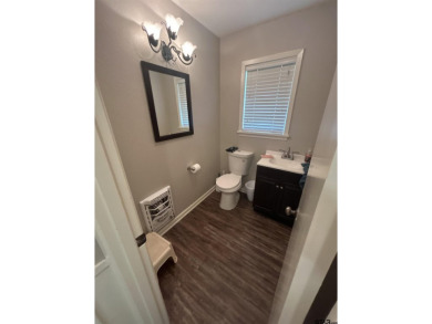 Welcome to this beautifully crafted ranch-style residence that on Mount Pleasant Country Club in Texas - for sale on GolfHomes.com, golf home, golf lot