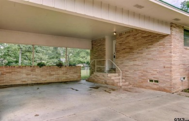 Welcome to this beautifully crafted ranch-style residence that on Mount Pleasant Country Club in Texas - for sale on GolfHomes.com, golf home, golf lot