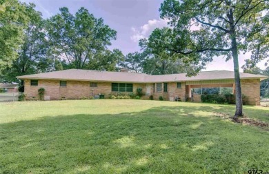 Welcome to this beautifully crafted ranch-style residence that on Mount Pleasant Country Club in Texas - for sale on GolfHomes.com, golf home, golf lot