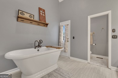 From sunsets over the fairway to your own private backyard oasis on Canongate At Flat Creek Club in Georgia - for sale on GolfHomes.com, golf home, golf lot