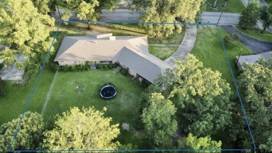 Welcome to this beautifully crafted ranch-style residence that on Mount Pleasant Country Club in Texas - for sale on GolfHomes.com, golf home, golf lot