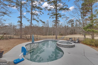 From sunsets over the fairway to your own private backyard oasis on Canongate At Flat Creek Club in Georgia - for sale on GolfHomes.com, golf home, golf lot
