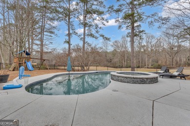From sunsets over the fairway to your own private backyard oasis on Canongate At Flat Creek Club in Georgia - for sale on GolfHomes.com, golf home, golf lot