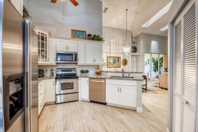 Just steps from the pool, this beautifully maintained 2-bedroom on PGA National Golf Club in Florida - for sale on GolfHomes.com, golf home, golf lot