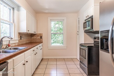 Look at this charming historic home with modern updates on an on Whispering Woods in North Carolina - for sale on GolfHomes.com, golf home, golf lot