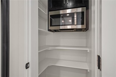 Discover modern, low-maintenance living in this stunning 1 on The Golf Club of Kansas in Kansas - for sale on GolfHomes.com, golf home, golf lot