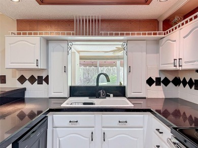 Lakefront Living in Beacon Woods Village with no flood insurance on Beacon Woods Golf Club in Florida - for sale on GolfHomes.com, golf home, golf lot