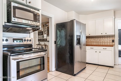 Look at this charming historic home with modern updates on an on Whispering Woods in North Carolina - for sale on GolfHomes.com, golf home, golf lot