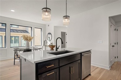 Discover modern, low-maintenance living in this stunning 1 on The Golf Club of Kansas in Kansas - for sale on GolfHomes.com, golf home, golf lot