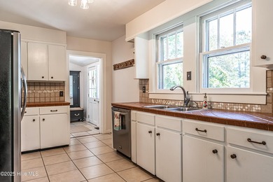 Look at this charming historic home with modern updates on an on Whispering Woods in North Carolina - for sale on GolfHomes.com, golf home, golf lot