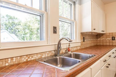 Look at this charming historic home with modern updates on an on Whispering Woods in North Carolina - for sale on GolfHomes.com, golf home, golf lot