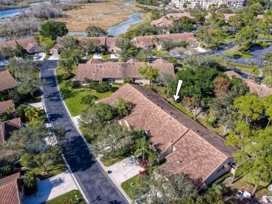 Just steps from the pool, this beautifully maintained 2-bedroom on PGA National Golf Club in Florida - for sale on GolfHomes.com, golf home, golf lot