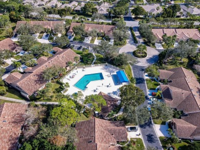 Just steps from the pool, this beautifully maintained 2-bedroom on PGA National Golf Club in Florida - for sale on GolfHomes.com, golf home, golf lot