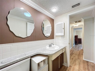 Lakefront Living in Beacon Woods Village with no flood insurance on Beacon Woods Golf Club in Florida - for sale on GolfHomes.com, golf home, golf lot