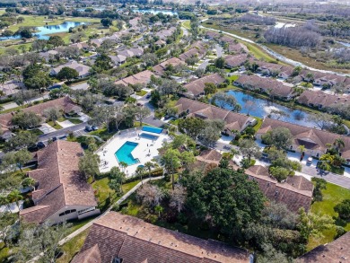 Just steps from the pool, this beautifully maintained 2-bedroom on PGA National Golf Club in Florida - for sale on GolfHomes.com, golf home, golf lot