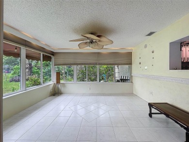 Lakefront Living in Beacon Woods Village with no flood insurance on Beacon Woods Golf Club in Florida - for sale on GolfHomes.com, golf home, golf lot