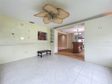 Lakefront Living in Beacon Woods Village with no flood insurance on Beacon Woods Golf Club in Florida - for sale on GolfHomes.com, golf home, golf lot