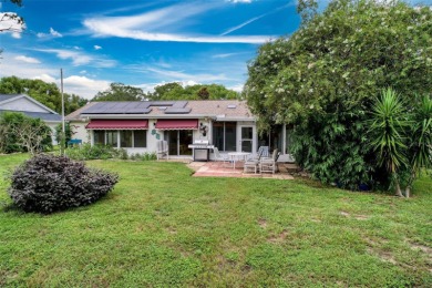 Lakefront Living in Beacon Woods Village with no flood insurance on Beacon Woods Golf Club in Florida - for sale on GolfHomes.com, golf home, golf lot