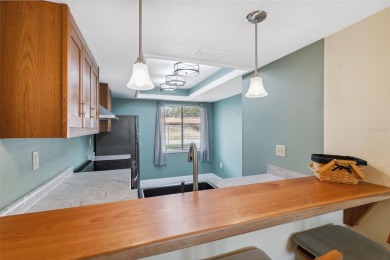 Step into comfort and style with this beautifully updated on East Lake Woodlands Country Club in Florida - for sale on GolfHomes.com, golf home, golf lot