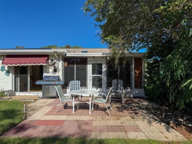 Lakefront Living in Beacon Woods Village with no flood insurance on Beacon Woods Golf Club in Florida - for sale on GolfHomes.com, golf home, golf lot