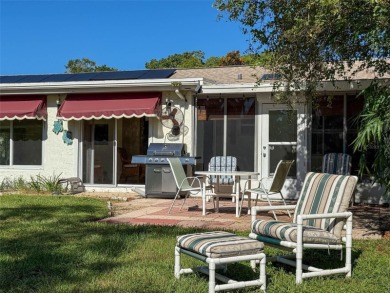 Lakefront Living in Beacon Woods Village with no flood insurance on Beacon Woods Golf Club in Florida - for sale on GolfHomes.com, golf home, golf lot