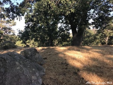 Very buildable lot on a quiet cul de sac with rock formations on Oak Tree Country Club in California - for sale on GolfHomes.com, golf home, golf lot