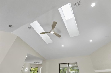 Light-Filled Designer Pool Home | New Roof | Gourmet Kitchen | on The Grand Club - Pine Lakes Course in Florida - for sale on GolfHomes.com, golf home, golf lot