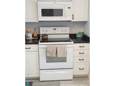 Beautiful Corner unit, nicely updated with direct golf course on  in Florida - for sale on GolfHomes.com, golf home, golf lot