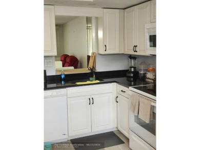 Beautiful Corner unit, nicely updated with direct golf course on  in Florida - for sale on GolfHomes.com, golf home, golf lot