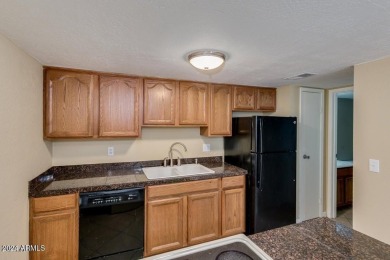 Fabulous 2-story townhome with 2 bedrooms, 1.5 baths. Kitchen on Raven Golf Club At South Mountain in Arizona - for sale on GolfHomes.com, golf home, golf lot