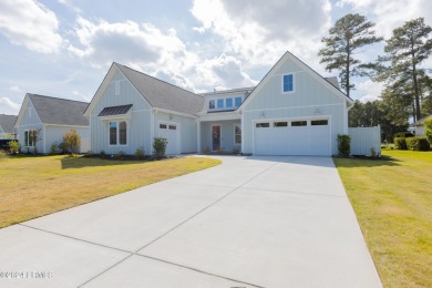 This nearly new ''Shoal'' with farmhouse elevation overlooks a on Hampton Pointe Golf Course in South Carolina - for sale on GolfHomes.com, golf home, golf lot