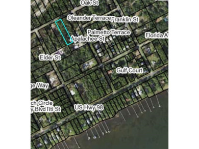 Nestled down Pinewood Avenue in charming Carrabelle, Florida on St. James Bay in Florida - for sale on GolfHomes.com, golf home, golf lot