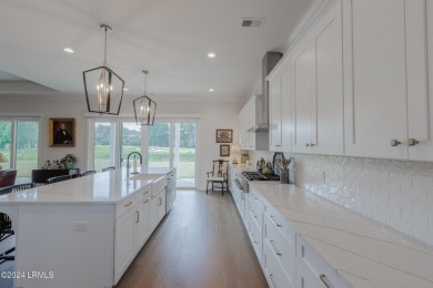 This nearly new ''Shoal'' with farmhouse elevation overlooks a on Hampton Pointe Golf Course in South Carolina - for sale on GolfHomes.com, golf home, golf lot