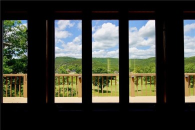 Welcome to your dream home in the heart of the Ozarks! Nestled on Holiday Island Executive Golf Course in Arkansas - for sale on GolfHomes.com, golf home, golf lot