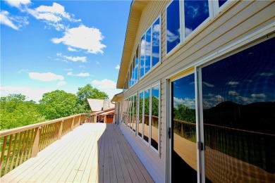 Welcome to your dream home in the heart of the Ozarks! Nestled on Holiday Island Executive Golf Course in Arkansas - for sale on GolfHomes.com, golf home, golf lot