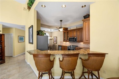 Perched high above it all, this rare end-unit penthouse offers on Pelican Marsh Golf Club in Florida - for sale on GolfHomes.com, golf home, golf lot