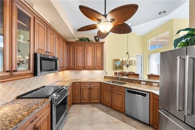 Perched high above it all, this rare end-unit penthouse offers on Pelican Marsh Golf Club in Florida - for sale on GolfHomes.com, golf home, golf lot