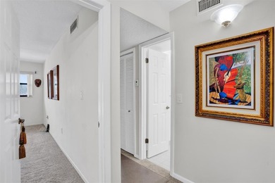 3/2.5 Alhambra Townhome, just under 1900sq ft, waterfront & on Pine Island Ridge Country Club in Florida - for sale on GolfHomes.com, golf home, golf lot