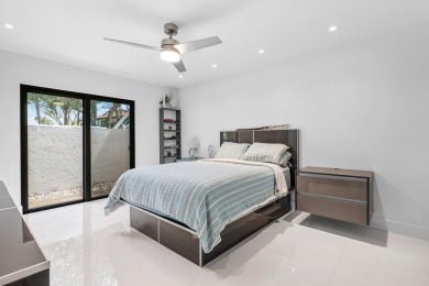 Modern masterpiece model home belonging to builder with the on Boca Lago Golf and Country Club in Florida - for sale on GolfHomes.com, golf home, golf lot