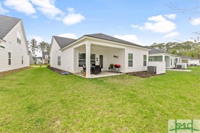 This gorgeous home is located in the luxury gated community of on Savannah Quarters Country Club in Georgia - for sale on GolfHomes.com, golf home, golf lot