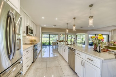 This home has been lovingly updated with large porcelain floors on Eastpointe Country Club in Florida - for sale on GolfHomes.com, golf home, golf lot