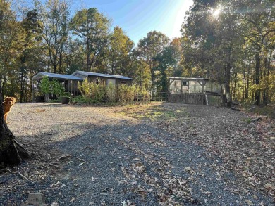 Experience the welcoming beauty of this two story Unrique Modern on Glenwood Country Club in Arkansas - for sale on GolfHomes.com, golf home, golf lot