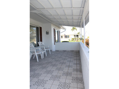 PRICED TO SELL!  It's not very often that a 2/2/2 1794 sq ft htd on Mainlands Golf Club in Florida - for sale on GolfHomes.com, golf home, golf lot