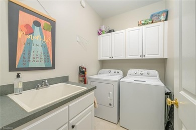 Don't miss this lovely custom brick 2-story home with 5 bedrooms on Salem Glen Country Club in North Carolina - for sale on GolfHomes.com, golf home, golf lot