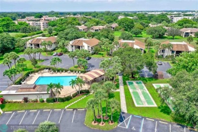 Immaculate condo with gorgeous views available in the highly on Pine Island Ridge Country Club in Florida - for sale on GolfHomes.com, golf home, golf lot